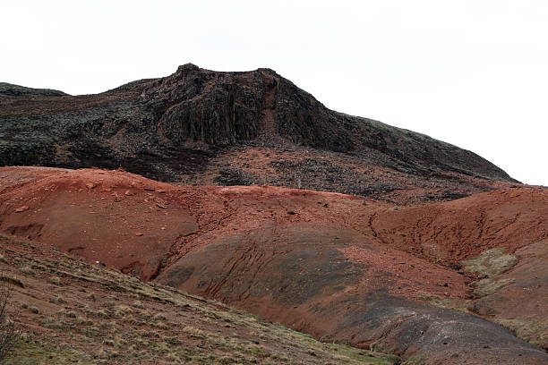 In active volcano crater (volcanic vent) - lava with fragmentary scoriae (cinder block lava), fumarole, solfataras, volcanic emanations (sour, hydrogen sulfide gas), sulfur deposits, etc. Kamchatka