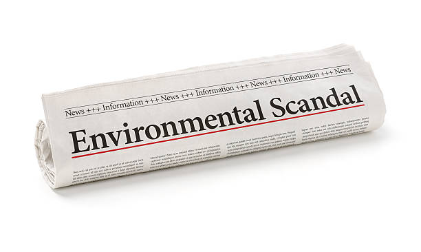 istock Rolled newspaper with the headline Environmental Scandal 497089646