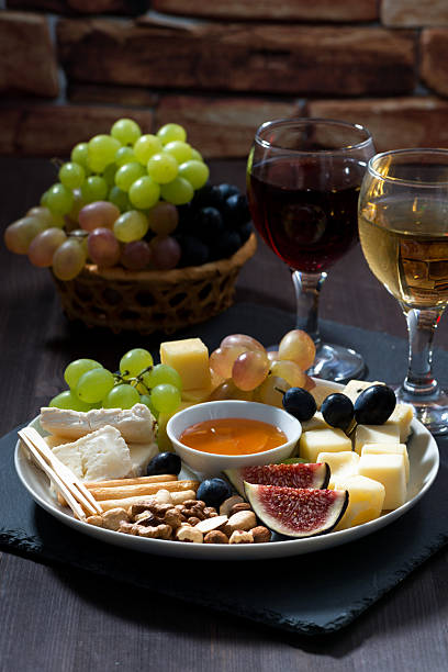 istock Plate with deli snacks and wine, vertical 497091292