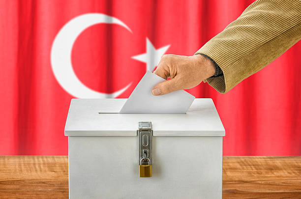 Man putting a ballot into a voting box - Turkey stock photo