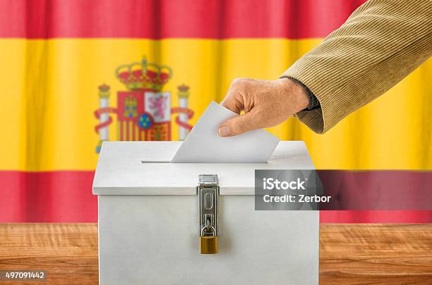 Man Putting A Ballot Into A Voting Box Spain Stock Photo - Download Image Now - 2015, Adult, Advice