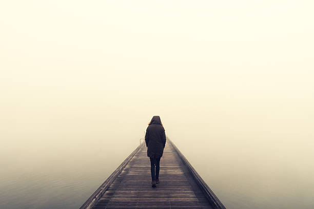istock Woman Crossing The Bridge 497092964