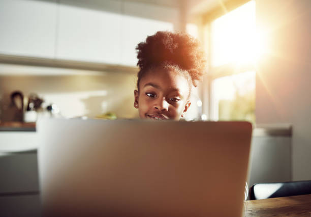 istock Little girl with at a laptop computer 497094160