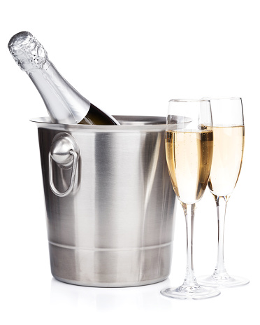 Champagne bottle in bucket and two glasses. Isolated on white background
