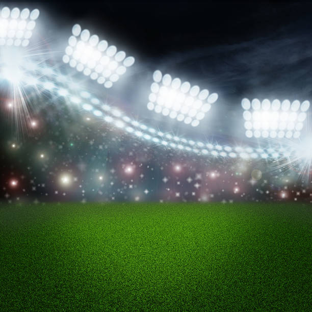 istock Soccer ball on green stadium arena 497097217