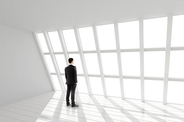 istock Businessman in the white loft interior 497097798