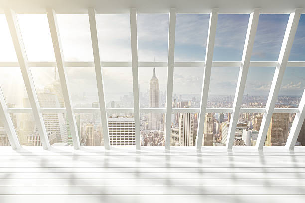 istock Beautiful empty white loft interior with city view at dawn 497097936