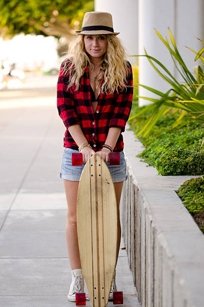 istock Cute blonde posing with skateboard 497098695
