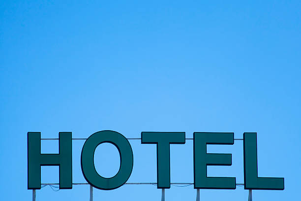 istock Hotel sign and blue sky 497099087