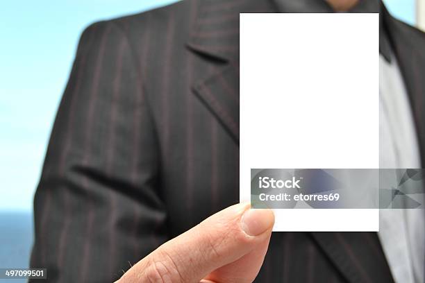 Man With A White Card In Hand Stock Photo - Download Image Now - Adult, Business, Business Finance and Industry