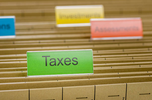 istock Hanging file folder labeled with Taxes 497099622