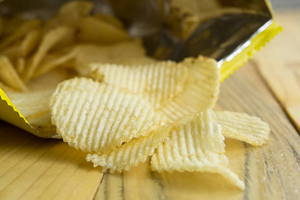 istock potato chip fat cholesterol salted junk fast food concept 497100334