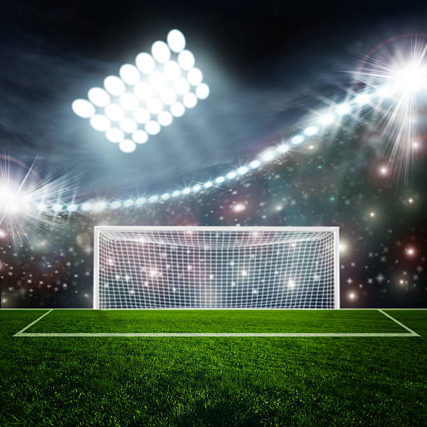 istock Soccer ball on green stadium arena 497102185