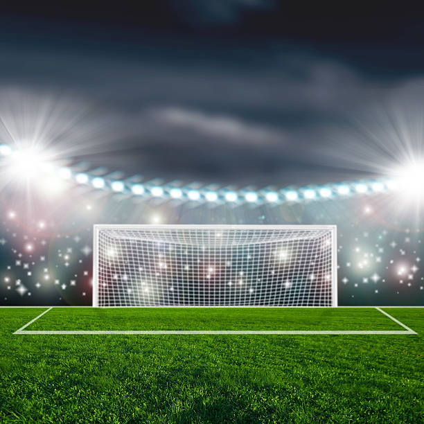 istock Soccer ball on green stadium arena 497102197