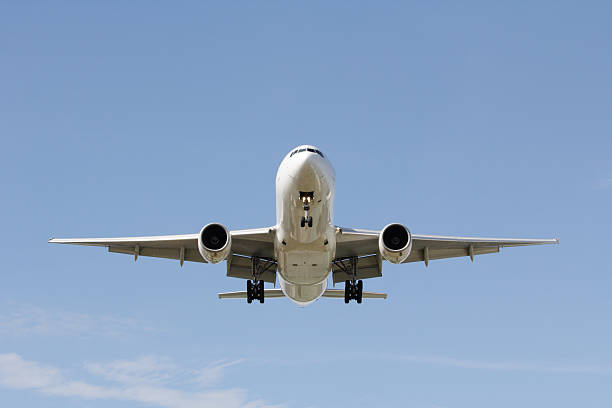 Front view landing airplane stock photo