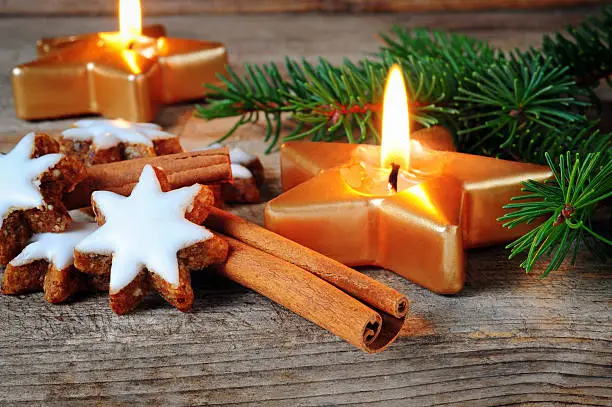 Traditional cinnamon stars biscuits over wooden texture