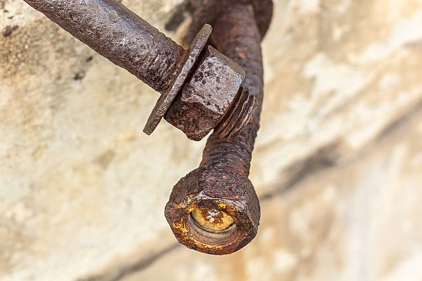 istock Corrosive rusted bolt with nut. Grunge industrial construction c 497104648