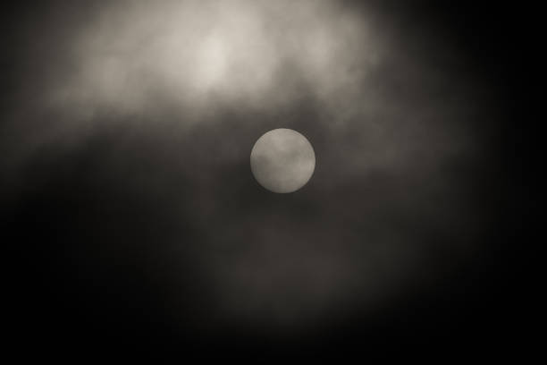 istock Full Sun behind heavy Fog black and white 497104738