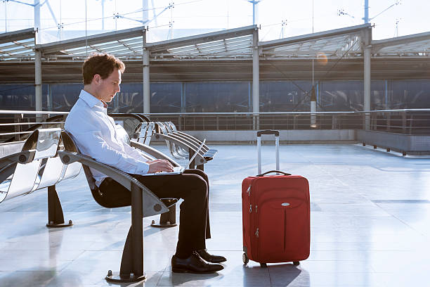 istock Working on laptop in airport while waiting for flight 497104842