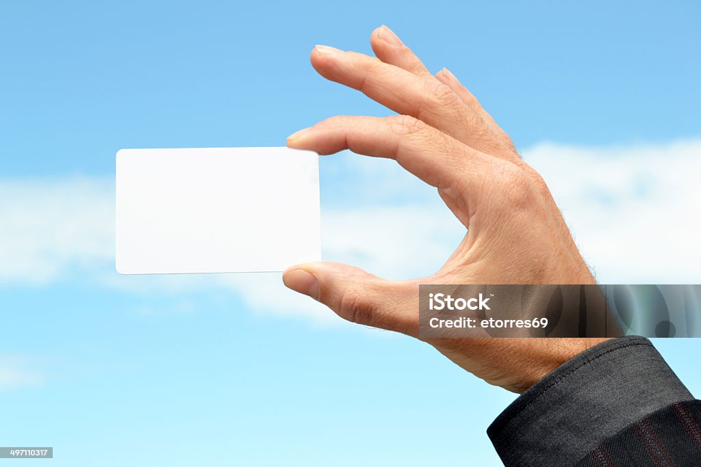 Man with a white card in hand Adult Stock Photo