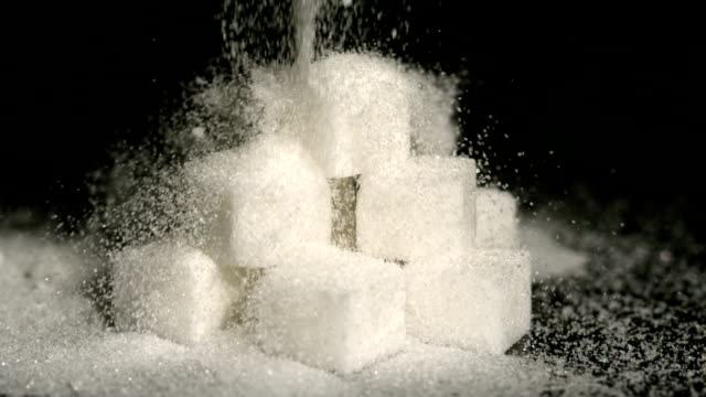 Powdered sugar falling onto cubes