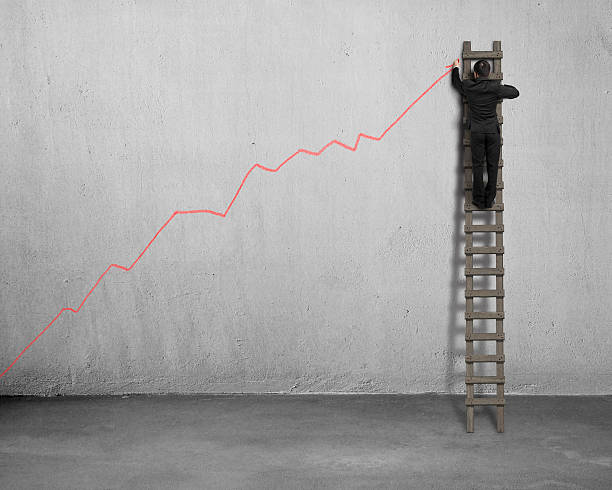 istock Drawing growing red arrow on concrete wall 497113967