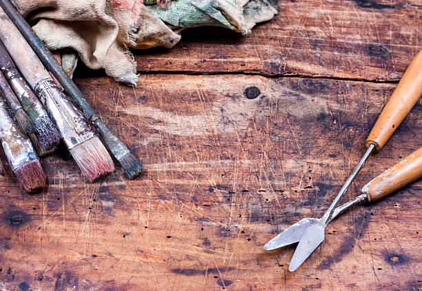 Paint brushes on wooden table