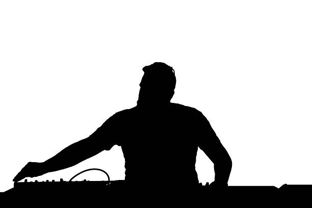 DJ silhouette spinning the turntables stock photo