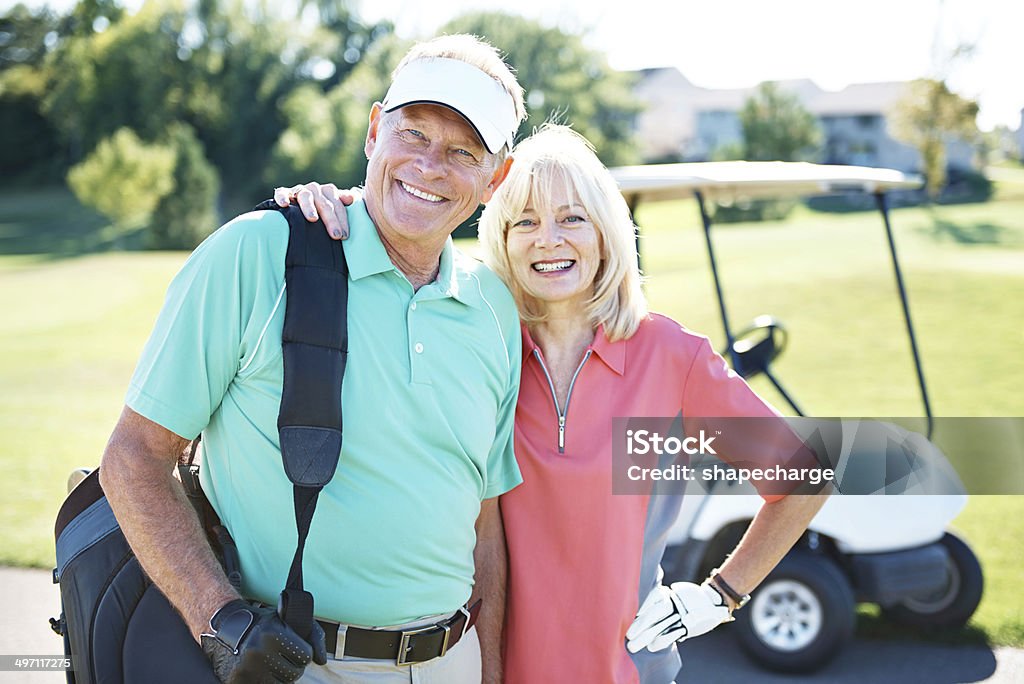 Not just partners in life but also on the course Portrait of a happy mature couple standing together on a golf coursehttp://195.154.178.81/DATA/istock_collage/0/shoots/784418.jpg 60-69 Years Stock Photo