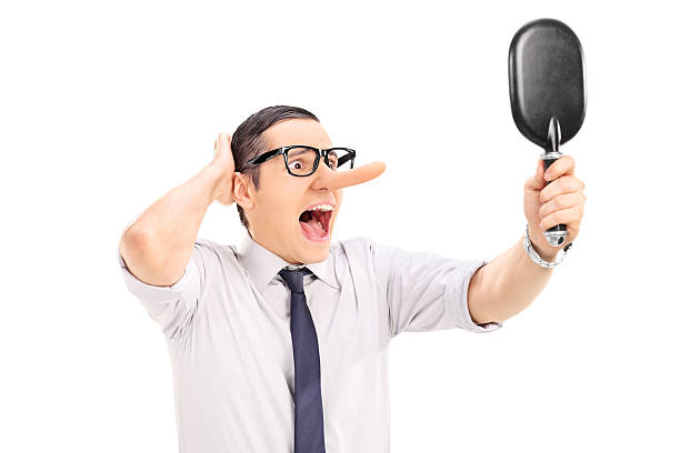 Furious man with long nose looking in a mirror