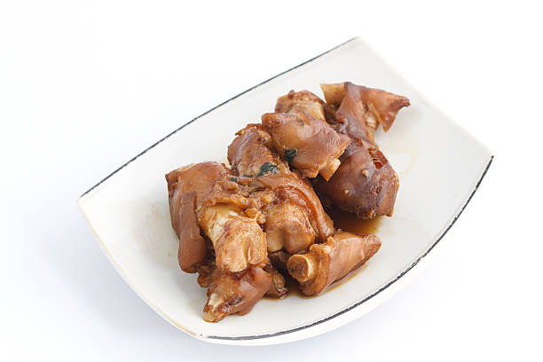 istock Stewed pork leg in white plate on white background 497119488