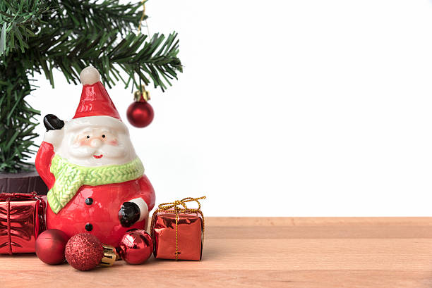 istock Santa claus with the gift and christmas tree 497119530