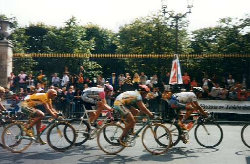 Paris, France - August 2, 1998: Vintage shot of the final race of Tour de France in 1998 at the Champs Elysees in Paris, with the winner Marco Pantani riding in yellow shirt. 