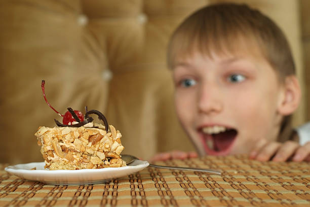 istock Beautiful good lad sitting at a table 497122646