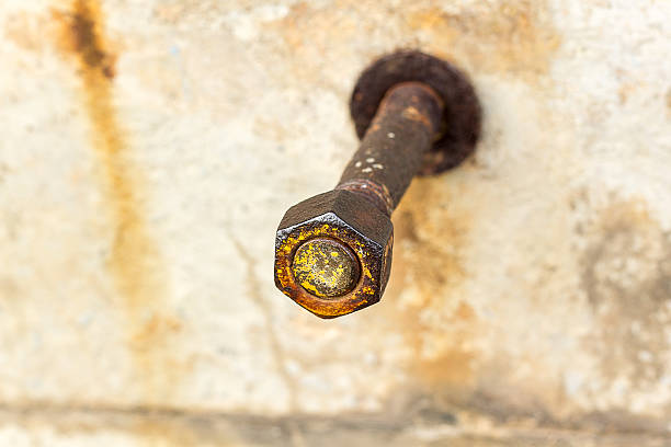 istock Corrosive rusted bolt with nut. Grunge industrial construction c 497123362