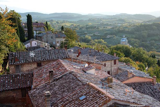 istock montepulciano - roof and panorama 497123428