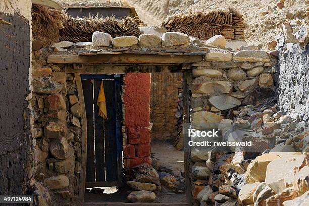 Wooden Door In Stone Wall Sakyatibet 1826 Stock Photo - Download Image Now - 2015, Animal Dung, Courtyard
