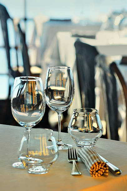 istock Wine glasses and dishes on the summer terrace 497125618
