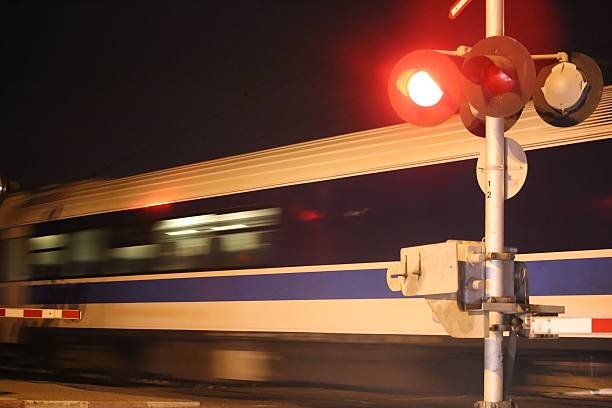 istock Night Train speeds in Railway Crossing 497125920