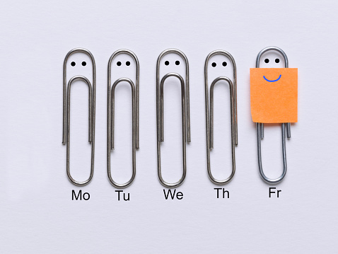 Row of clips appearing sad faces except the corresponding clip smiley face that has come the weekend