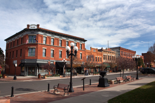 Across from the Union Depot, 1880's era red brick buildings including the Coors Building, L'Unique Building, and the Nardini-Arcade Block line B Street in the historic South Pueblo, Colorado. The district is listed on the National Register of Historic Places.