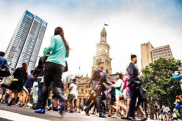 Sydney downtown, blurred intersection people and traffic