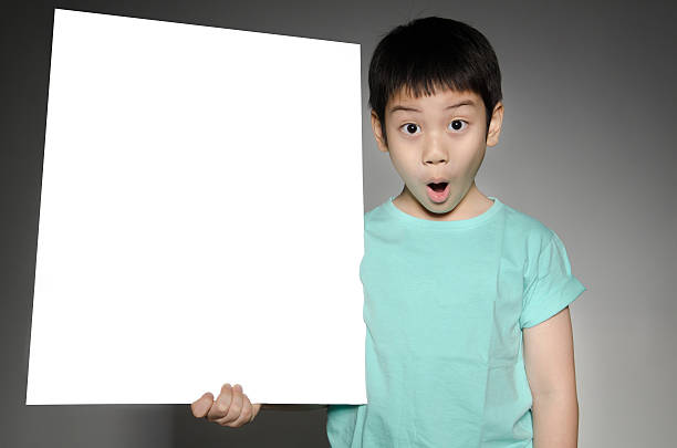 istock Asian cute boy with big white  blank plate 497128141