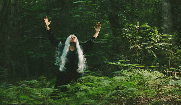 istock female sorcerer in the woods 497128333
