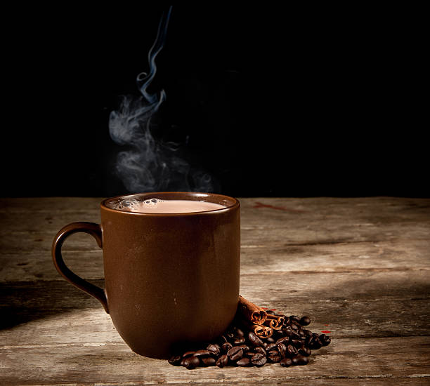 istock brown cup and wooden space in dark 497128649
