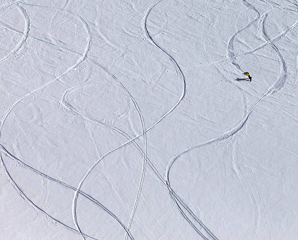 istock Snowboarder downhill on off piste slope 497129160