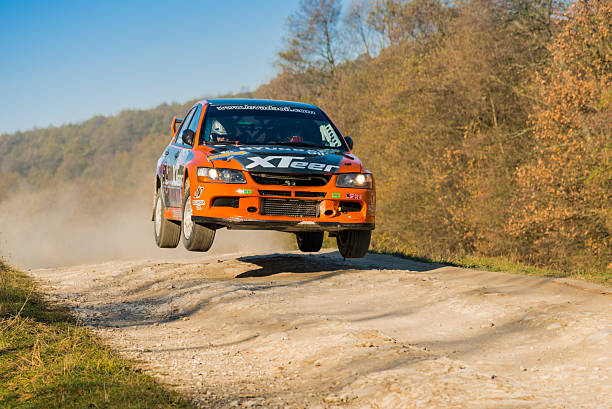 Mitsubishi Lancer Evo VII  competes at the annual Rally Galicia Lviv, Ukraine - November 1, 2015: Ivan Ostapchenko's  Mitsubishi Lancer Evo VII (No. 11)   competes at the annual Rally Galicia rally car racing stock pictures, royalty-free photos & images