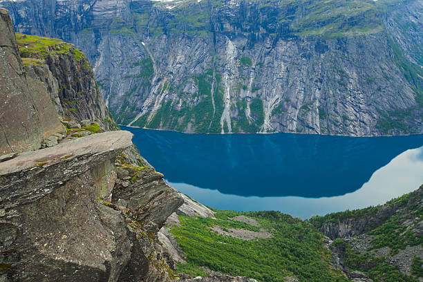 Famous norwegian rock hiking place - trolltunga, trolls tongue, Norway norway, nature, trolltunga, fjord, mountain, landscape, oslo, tongue, troll, hiking, norge, scandinavia, odda, summer, fjords, norwegian, lake, rock, iceland, reykjavik, ringedalsvatnet, hardanger, scandinavian, oslofjord, roldal, sognefjord, beautiful, blue, tourism, nordic, hardangervidda, prekestolen, preikestolen, kjerag, briksdal, Eidfjord, hordalann, Sognefjord, Hardangerfjord, Lysefjord, Geirangerfjord, Nordfjord, Oslofjord, Fjord Norway, Kjeragbolten, Pulpit Rock, Trollstigen, Voringsfossen, Vibrant, norway lysefjorden fjord norwegian currency stock pictures, royalty-free photos & images