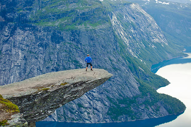 Famous norwegian rock hiking place - trolltunga, trolls tongue, Norway norway, nature, trolltunga, fjord, mountain, landscape, oslo, tongue, troll, hiking, norge, scandinavia, odda, summer, fjords, norwegian, lake, rock, iceland, reykjavik, ringedalsvatnet, hardanger, scandinavian, oslofjord, roldal, sognefjord, beautiful, blue, tourism, nordic, hardangervidda, prekestolen, preikestolen, kjerag, briksdal, Eidfjord, hordalann, Sognefjord, Hardangerfjord, Lysefjord, Geirangerfjord, Nordfjord, Oslofjord, Fjord Norway, Kjeragbolten, Pulpit Rock, Trollstigen, Voringsfossen, Vibrant, norway, nature, trolltunga, fjord, mountain, landscape, oslo, tongue, troll, hiking, norge, scandinavia, odda, summer, fjords, norwegian, lake, rock, iceland, reykjavik, ringedalsvatnet, hardanger, scandinavian, oslofjord, roldal, sognefjord, beautiful, blue, tourism, nordic, hardangervidda, prekestolen, preikestolen, kjerag, briksdal, Eidfjord, hordalann, Sognefjord, Hardangerfjord, Lysefjord, Geirangerfjord, Nordfjord, Oslofjord, Fjord Norway, Kjeragbolten, Pulpit Rock, Trollstigen, Voringsfossen, Vibrant, norway lysefjorden fjord norwegian currency stock pictures, royalty-free photos & images