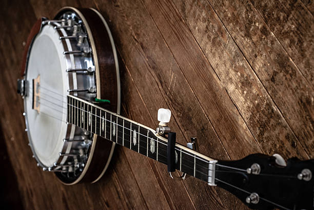 istock Five-string bluegrass banjo on distressed wooden planks. 497131311